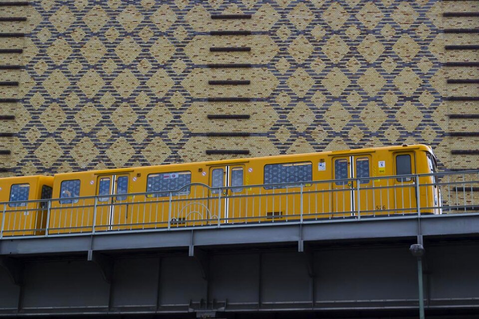 Yellow train on elevated railway