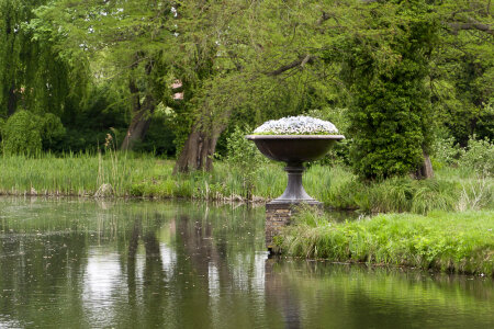Ornamental flower pot by lake
