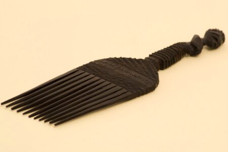 African hand made black wooden comb photo