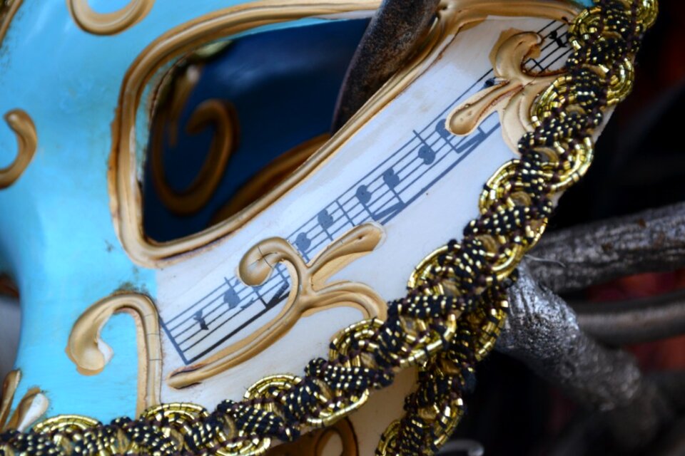 Venetian mask decorated with music scale