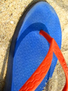 Colorful flip flop on sand photo