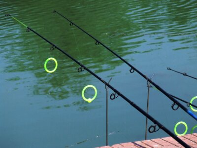 Fishing rods on lake photo
