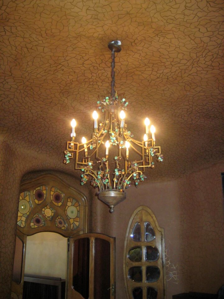 Chandelier on mosaic ceiling photo