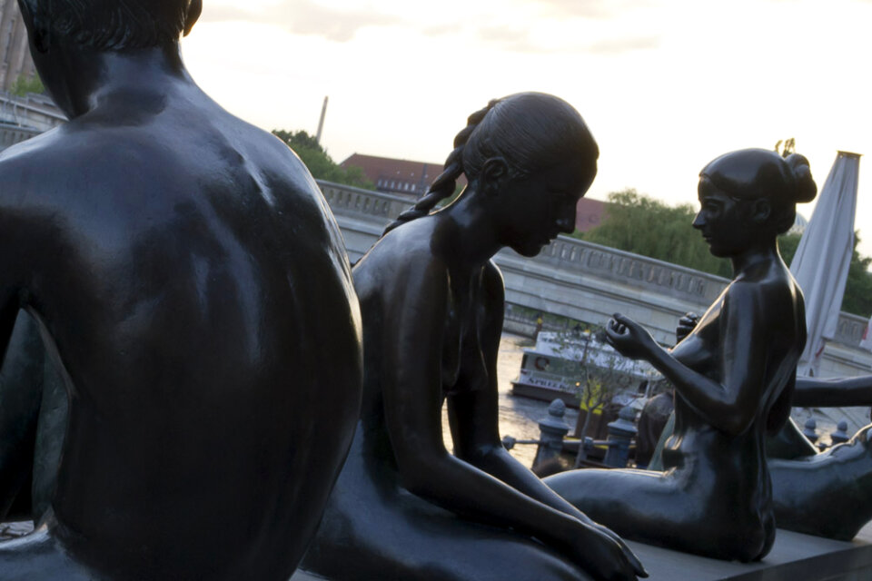 Statues of adolescent swimmers