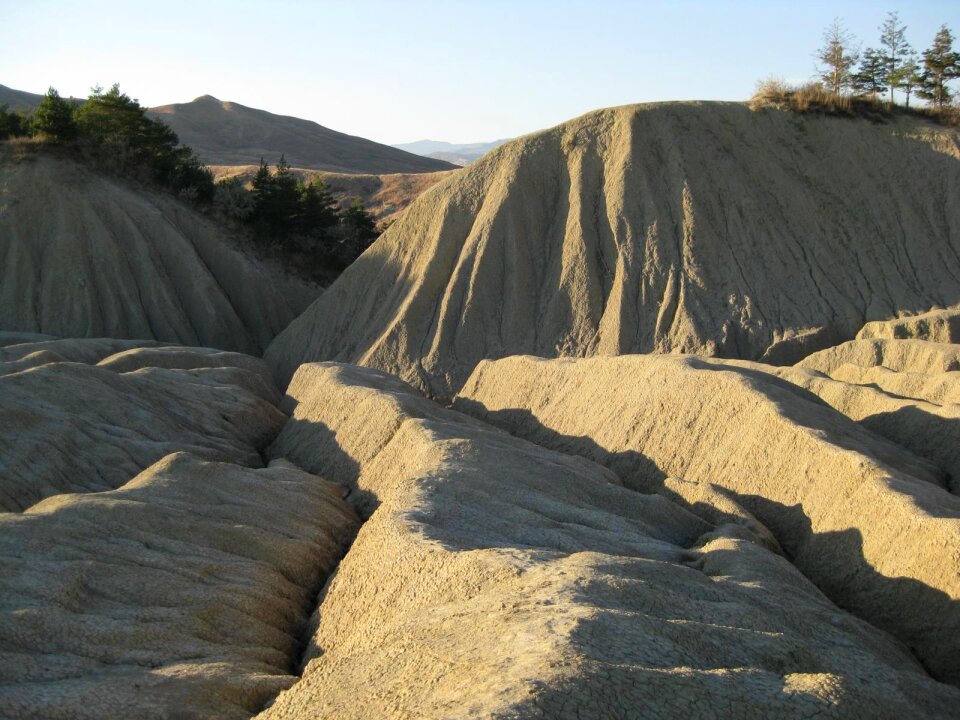 Sun setting on mud crevasses photo