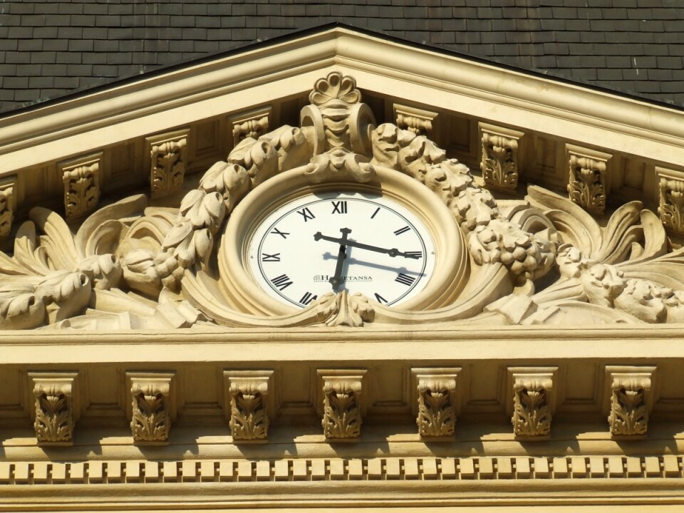 Clock under arch