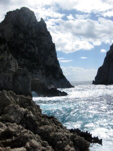Rocky coastline defeating waves photo