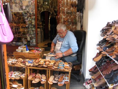 Man working in shoe shop photo