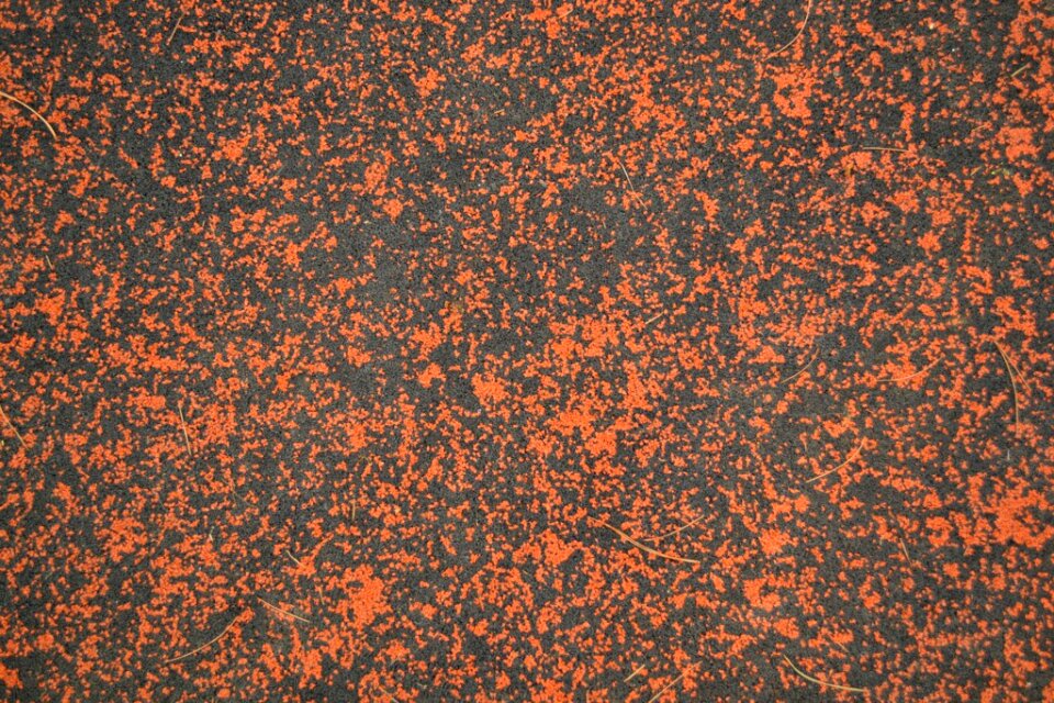Black and orange rubber mulch