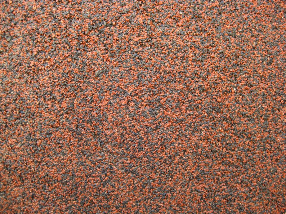Black and orange mineral sand texture