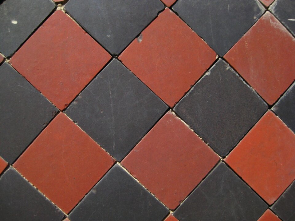Black and burgundy diamond pattern tiles