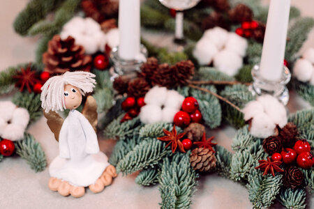 Christmas spruce decoration with candles and an angel 3 photo