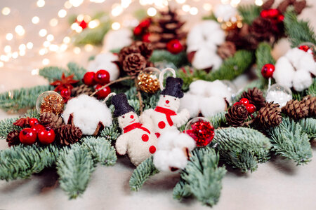 Christmas spruce decoration with snowmen and lights photo