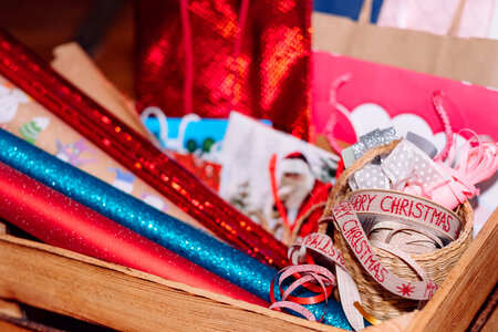 Christmas bags, wrapping paper and ribbons photo