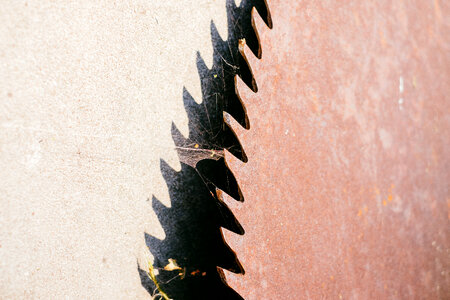 Old rusty saw blade closeup photo