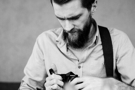 A man holding an analog camera 2