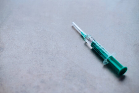 Disposable syringe with medication photo