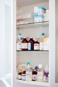 Medicine bottles and pills on shelves