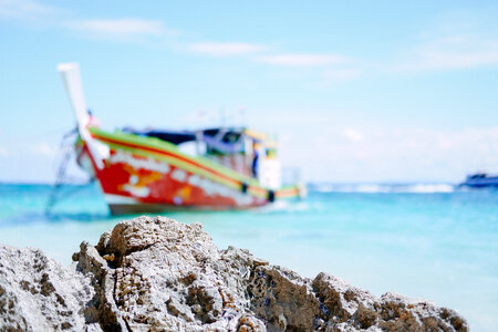 A blurry boat at the beach in Thailand photo