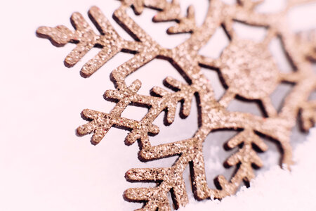 Gold glitter snowflake closeup photo