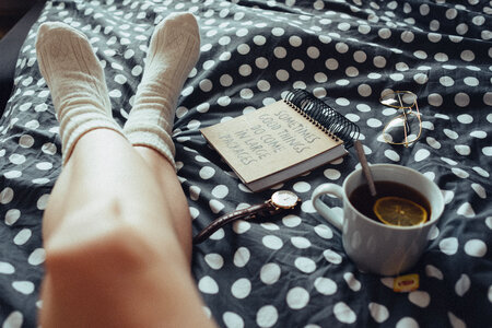 Chilling in bed in woollen socks photo