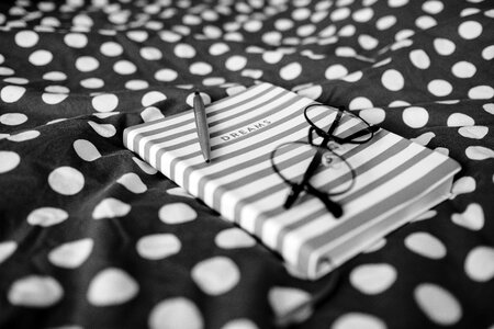 Dreams notebook and glasses photo