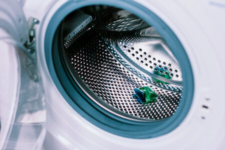 Laundry detergent pod inside a washing machine photo