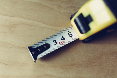 Metal tape measure tool closeup photo