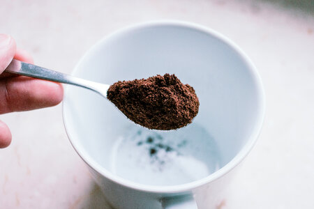 Ground coffee in a spoon photo
