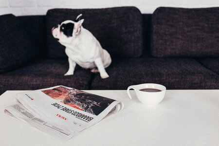 Cup of coffee and a newspaper on the table 3