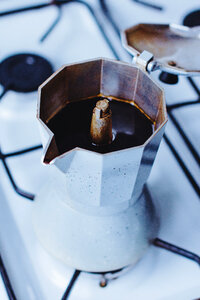 Brewing black coffee in a percolator photo