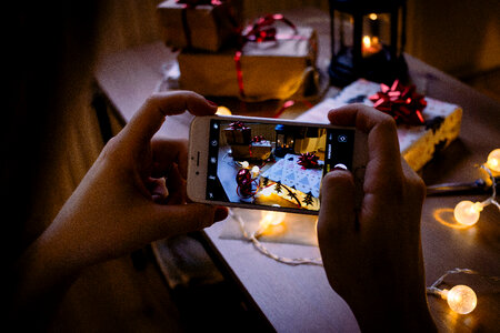 A female taking picture of a christmas gift 5 photo