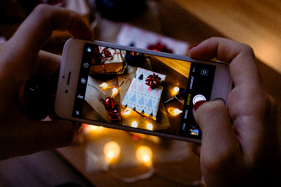 A female taking picture of a christmas gift 6
