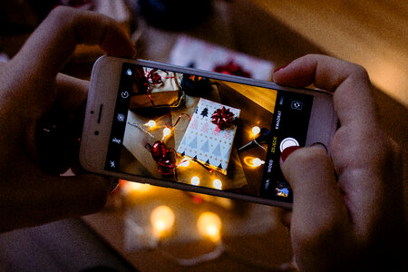 A female taking picture of a christmas gift 6 photo