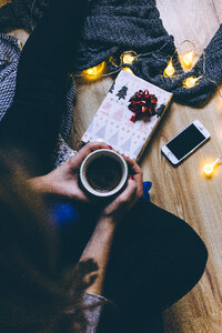 A female holding a mug in a festive setting 3