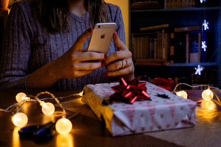 A female taking picture of a christmas gift 3 photo