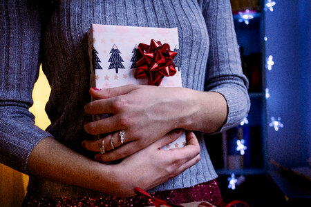 A female holding a christmas gift 5