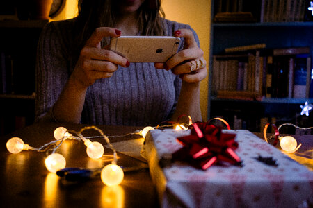 A female taking picture of a christmas gift