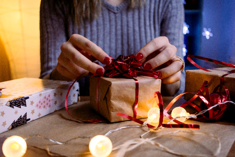 A female decorating a gift 5