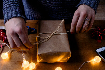 Female decorating a gift 3 photo