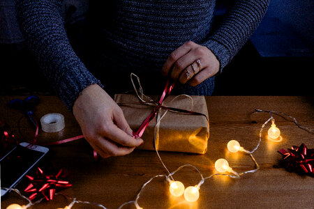 A female decorating a gift 4