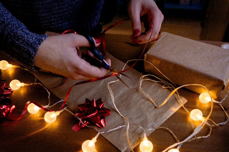 Female decorating a gift