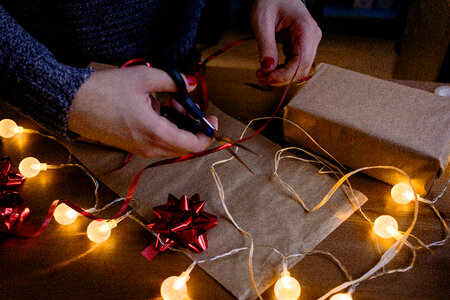 Female decorating a gift