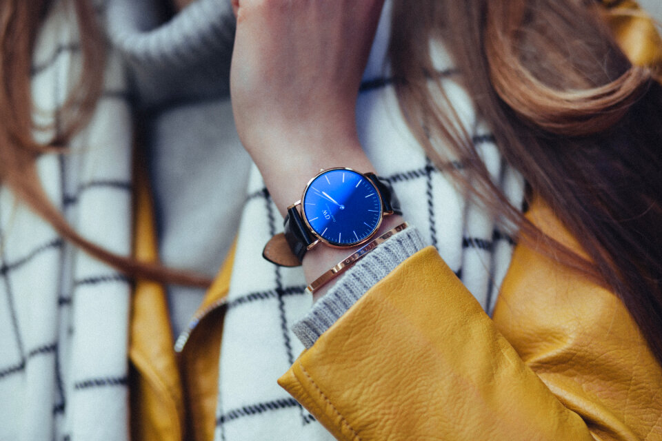 Black and gold female wristwatch