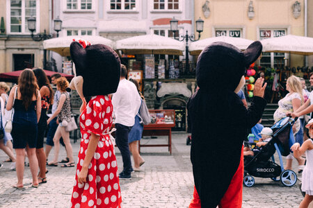 Mickey and Minnie waving at tourists