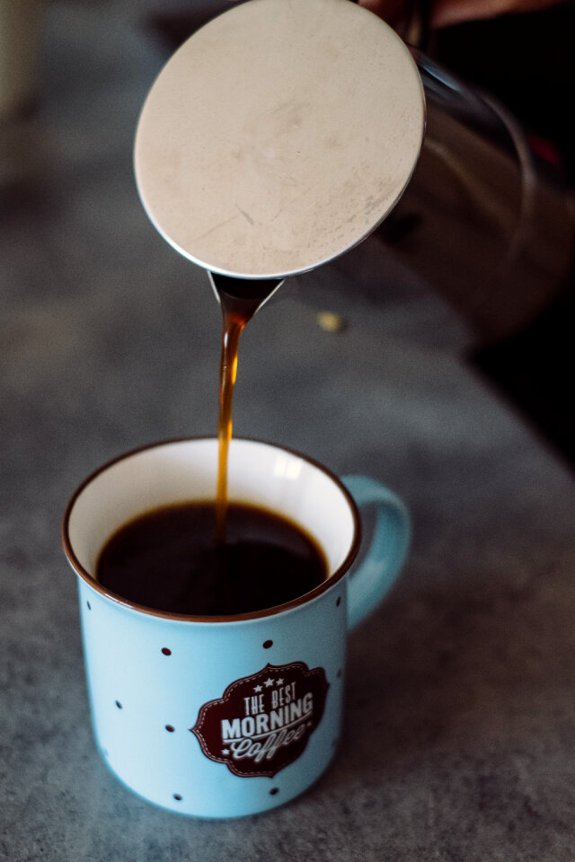 Pouring coffee from a percolator 2 photo