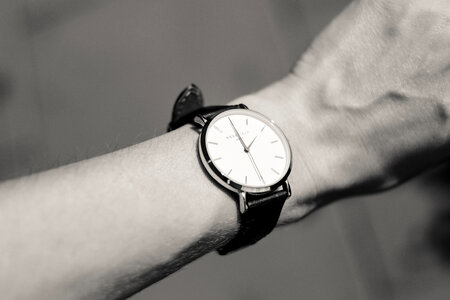 Female wristwatch in black and white photo