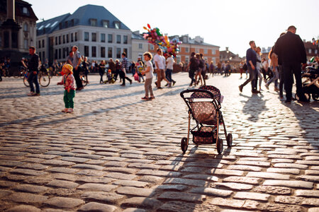 An empty stroller in a crowded Old Town square 3 photo