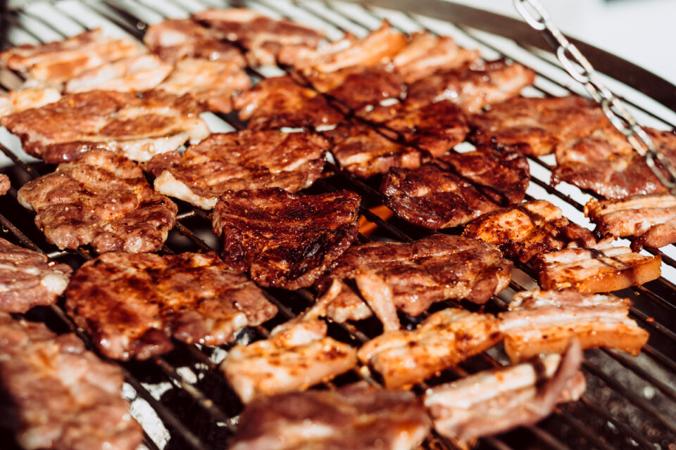 Pork and bacon on the grill closeup