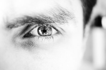 Single male eye in black and white photo